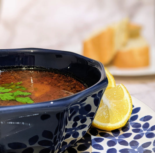 Libyan Soup served with lemon wedges and crusty bread.